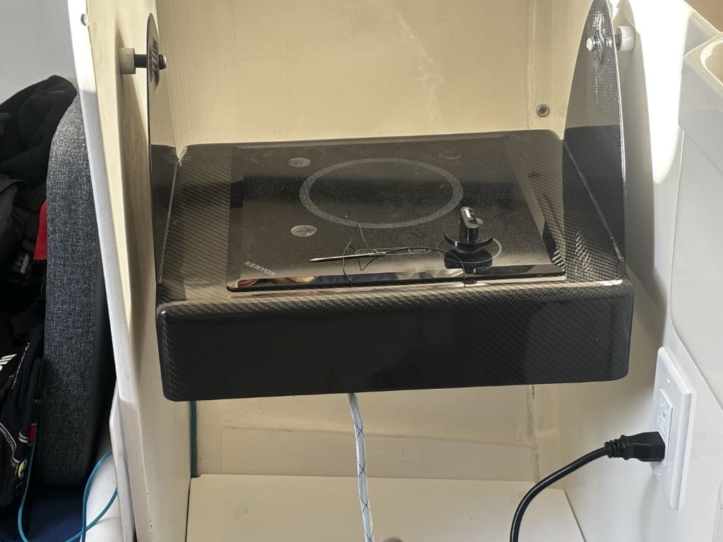 Custom carbon galley enclosure with flush-mount electric cooktop